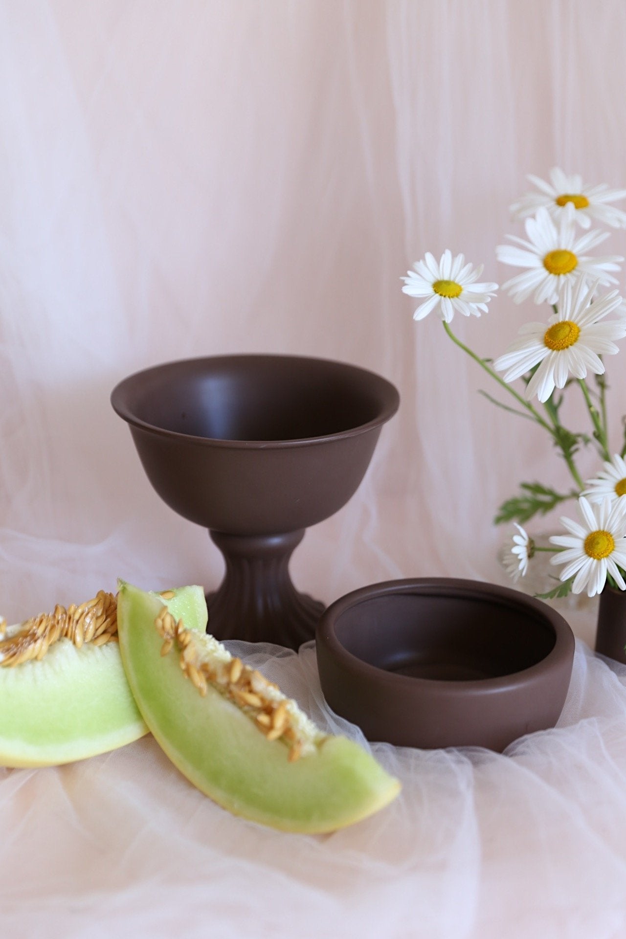 brown compote bowl and ceramic low bowl