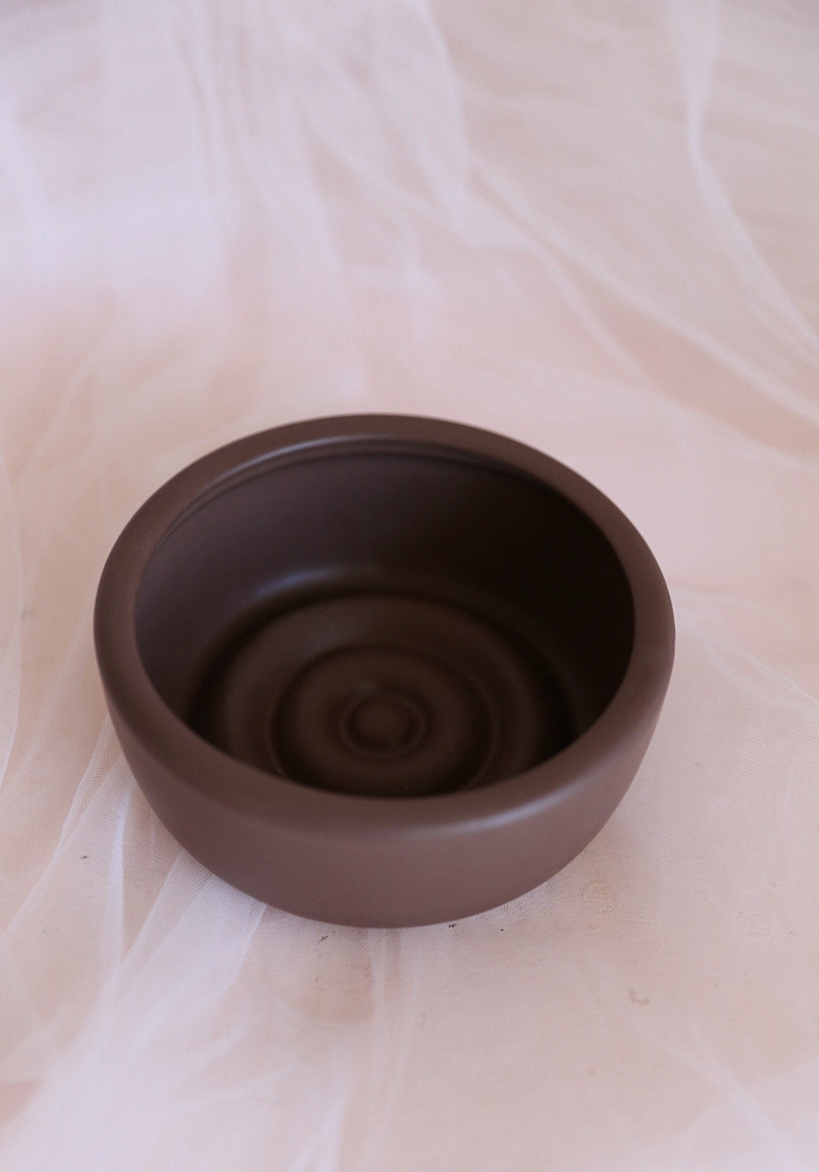 brown low ceramic bowl